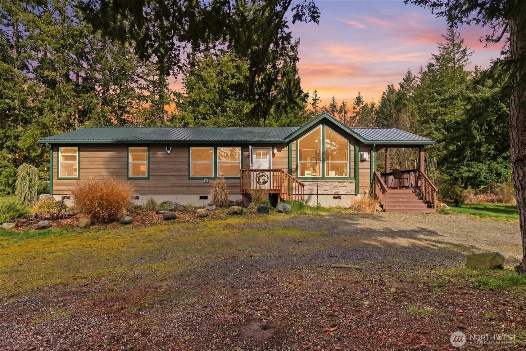 470 Sunshine Drive Sequim, WA 98382 - Photo 3 of 30 a front view of a house with a garden