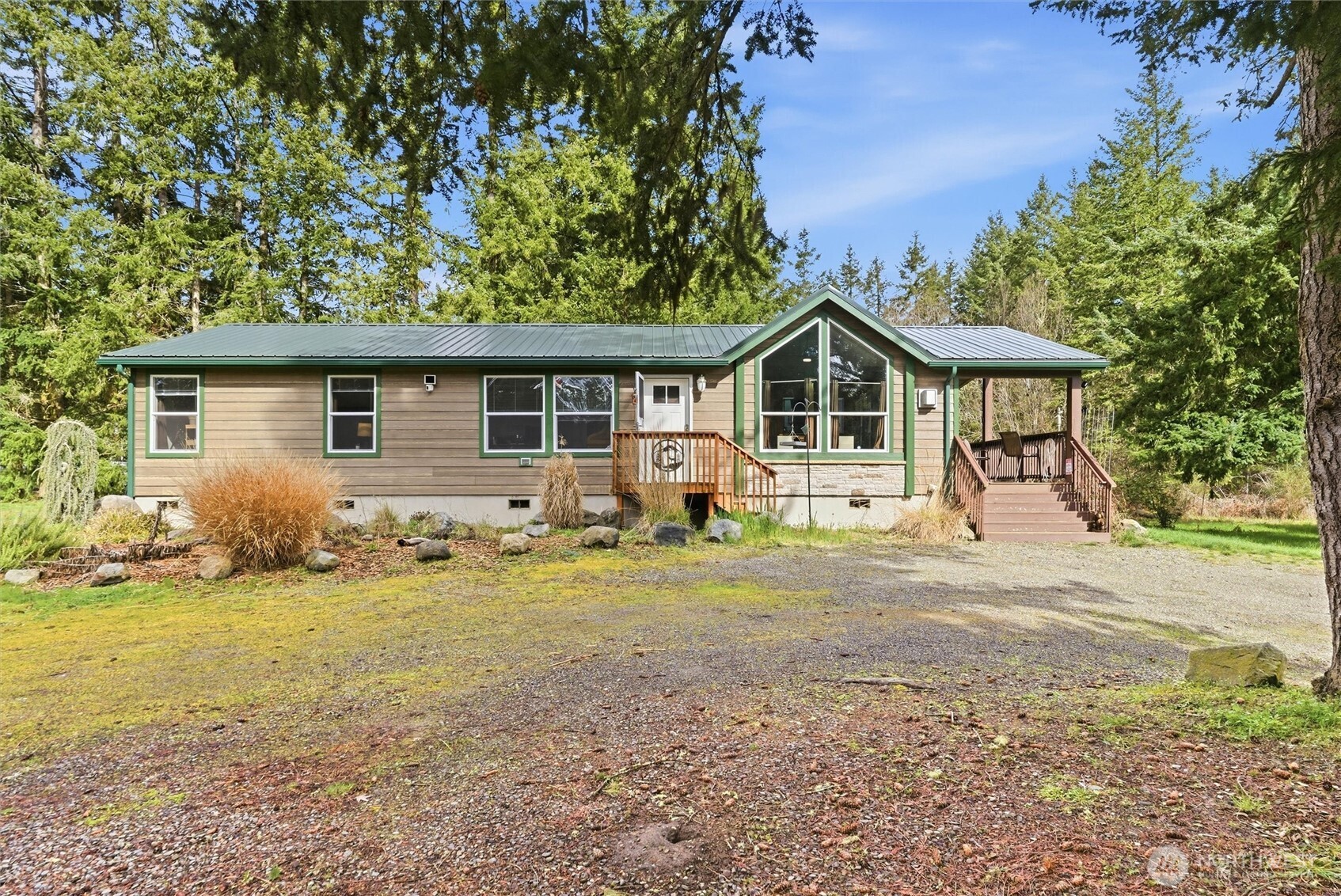 470 Sunshine Drive Sequim, WA 98382 - Photo 5 of 30 a front view of a house with a garden
