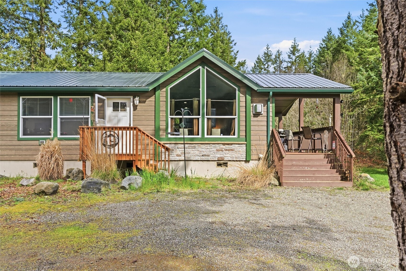 470 Sunshine Drive Sequim, WA 98382 - Photo 6 of 30 a front view of a house with garden