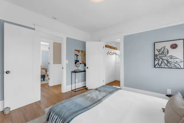 a bedroom with a bed and a dresser