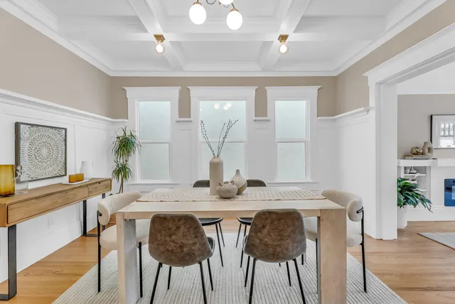 a view of a dining room with furniture and wooden floor