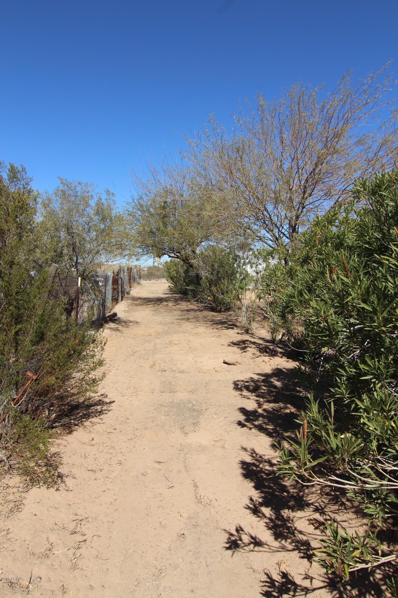 20102 West Arlington Road Buckeye, AZ 85326 - Photo 25 of 66 Dirt Driveway to back of lot