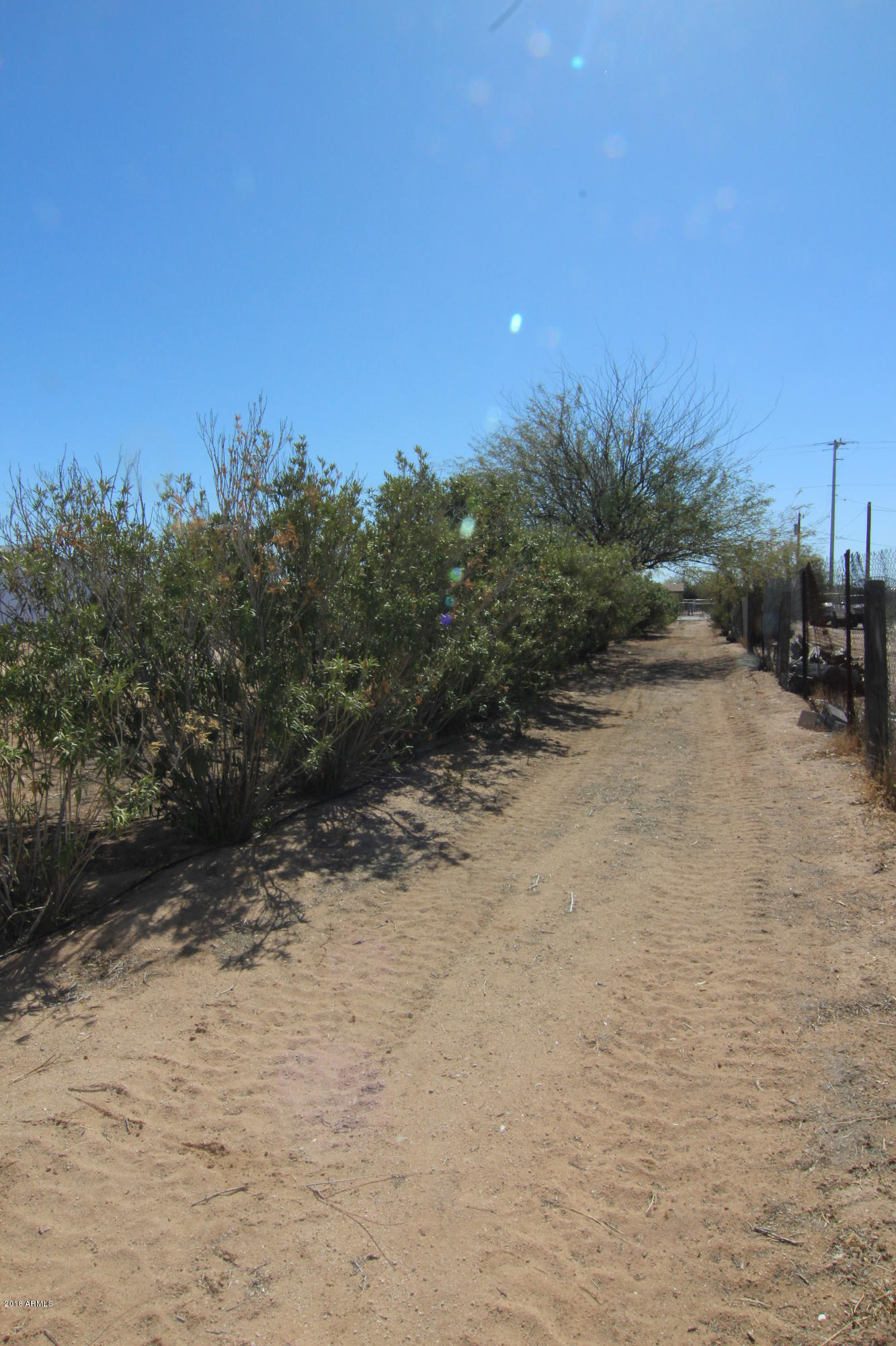 20102 West Arlington Road Buckeye, AZ 85326 - Photo 26 of 66 Dirt Driveway entire length of lot