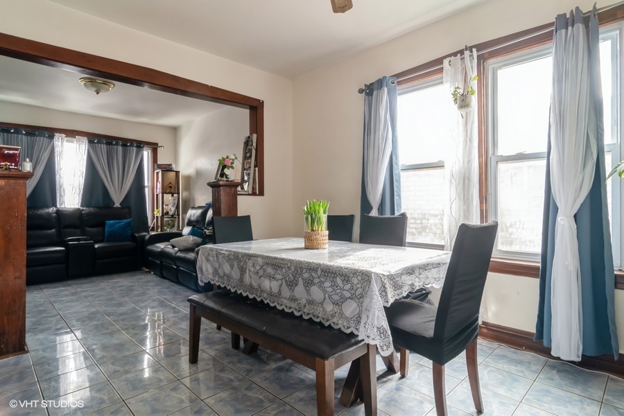 2180 North Mango Avenue Chicago, IL 60639 - Photo 9 of 18 a dining room with furniture and window