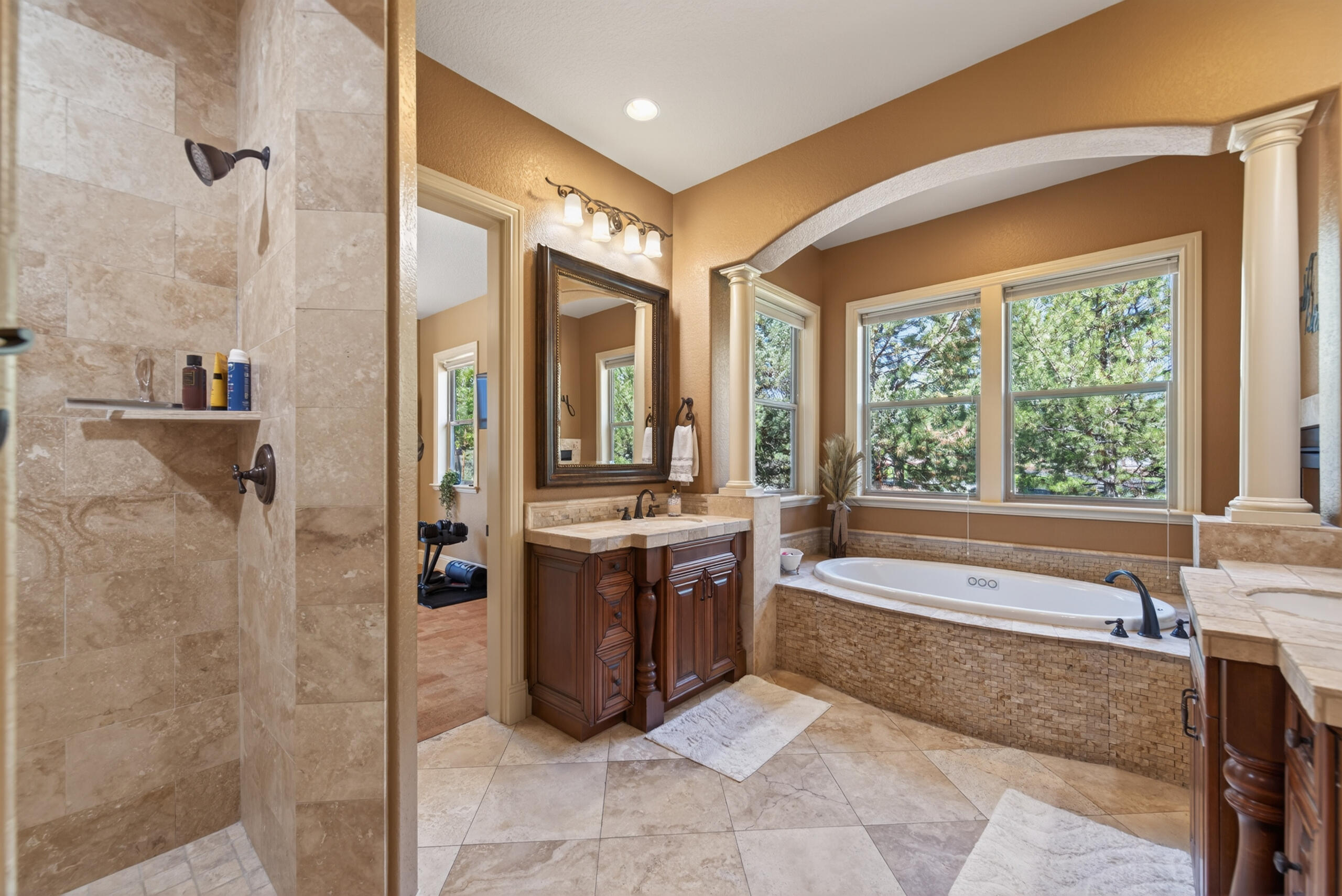 9009 Merlin Drive Redmond, OR 97756 - Photo 33 of 98 a spacious bathroom with a tub and sink