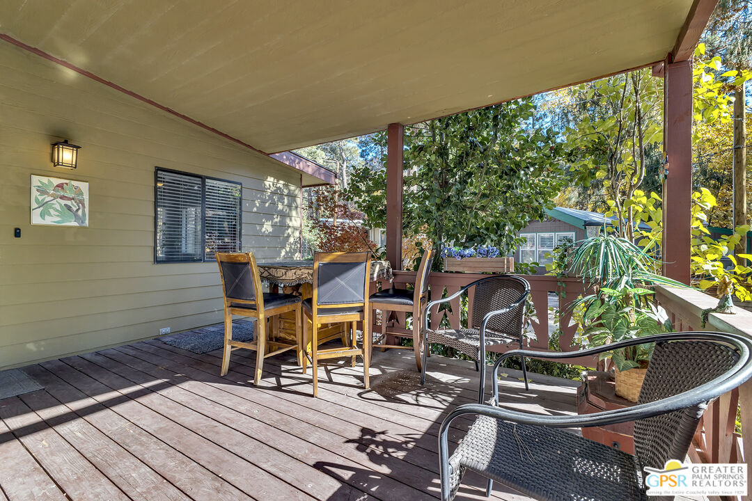 25955 Highway 243, Unit 18 Idyllwild, CA 92549 - Photo 13 of 43 a view of a chairs and table in patio