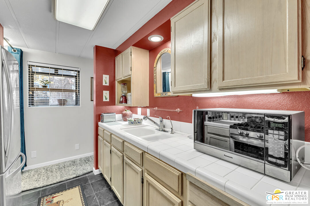 25955 Highway 243, Unit 18 Idyllwild, CA 92549 - Photo 23 of 43 a kitchen with a stove and a sink