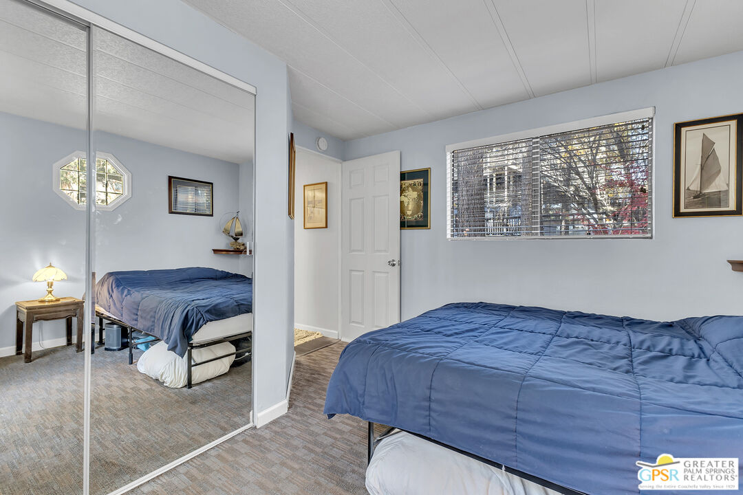 25955 Highway 243, Unit 18 Idyllwild, CA 92549 - Photo 29 of 43 a bedroom with a bed and window