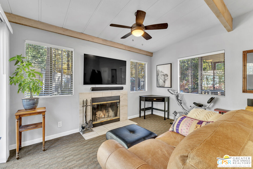 25955 Highway 243, Unit 18 Idyllwild, CA 92549 - Photo 3 of 43 a bedroom with a bed window and fireplace
