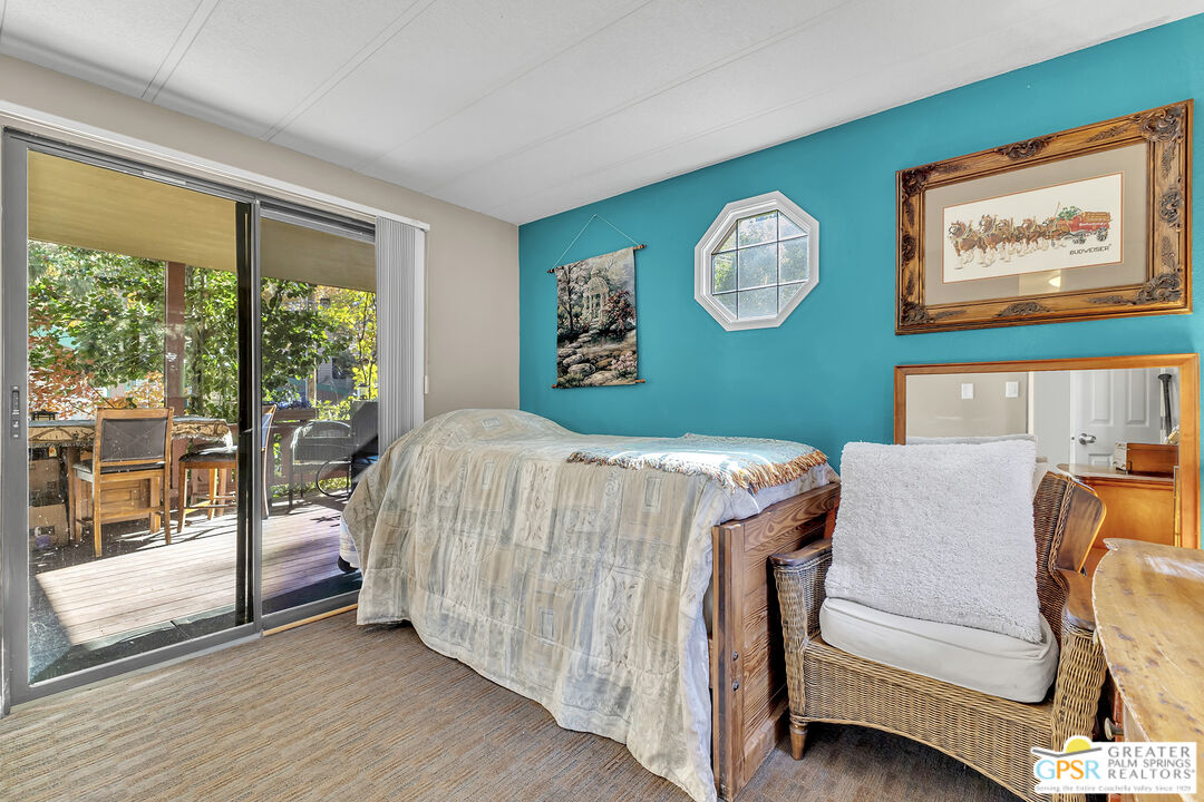 25955 Highway 243, Unit 18 Idyllwild, CA 92549 - Photo 32 of 43 a bedroom with a bed and a window