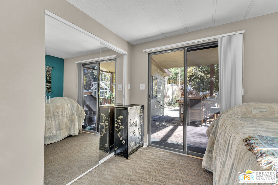 25955 Highway 243, Unit 18 Idyllwild, CA 92549 - Photo 34 of 43 a bedroom with furniture and a window