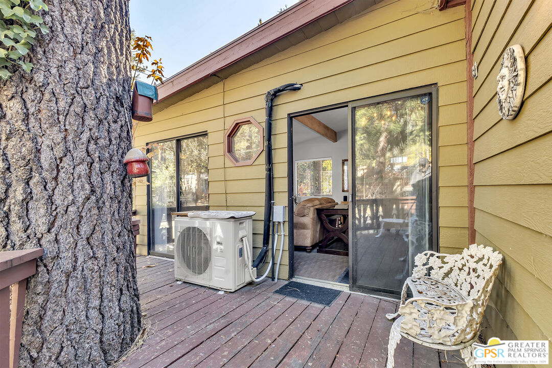 25955 Highway 243, Unit 18 Idyllwild, CA 92549 - Photo 38 of 43 a view of a deck with wooden floor and seating space