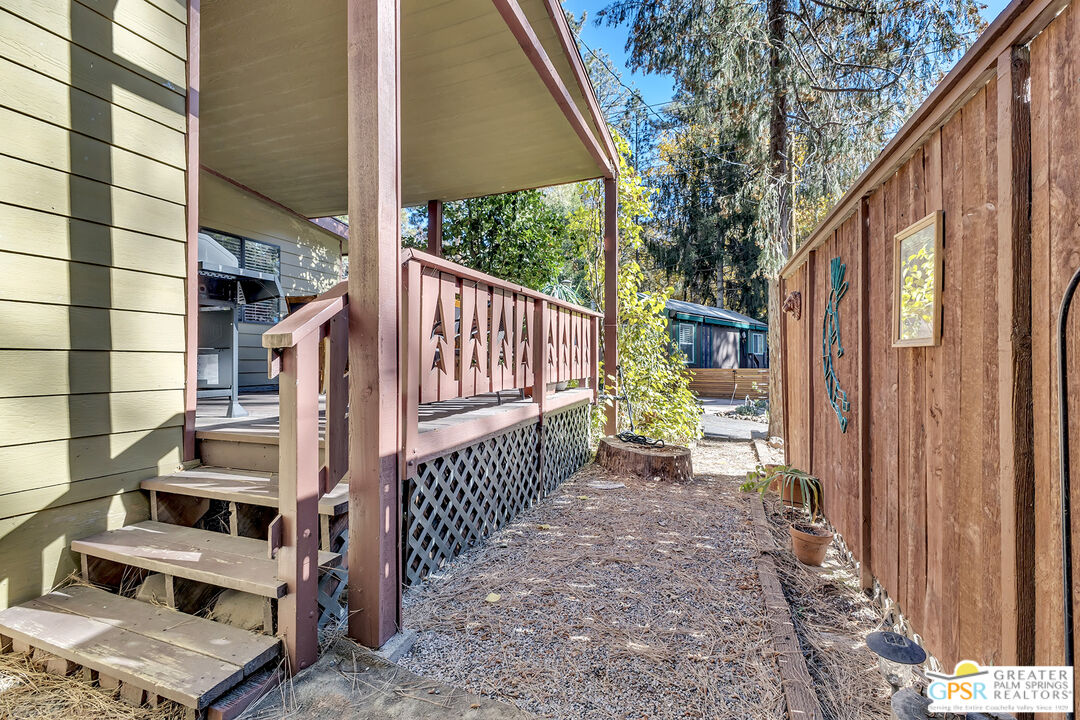 25955 Highway 243, Unit 18 Idyllwild, CA 92549 - Photo 43 of 43 a view of balcony with wooden fence and large trees