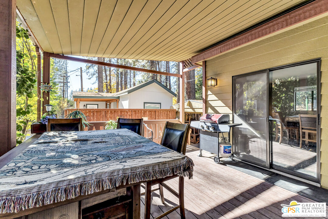 25955 Highway 243, Unit 18 Idyllwild, CA 92549 - Photo 9 of 43 a dining room with a table and chairs