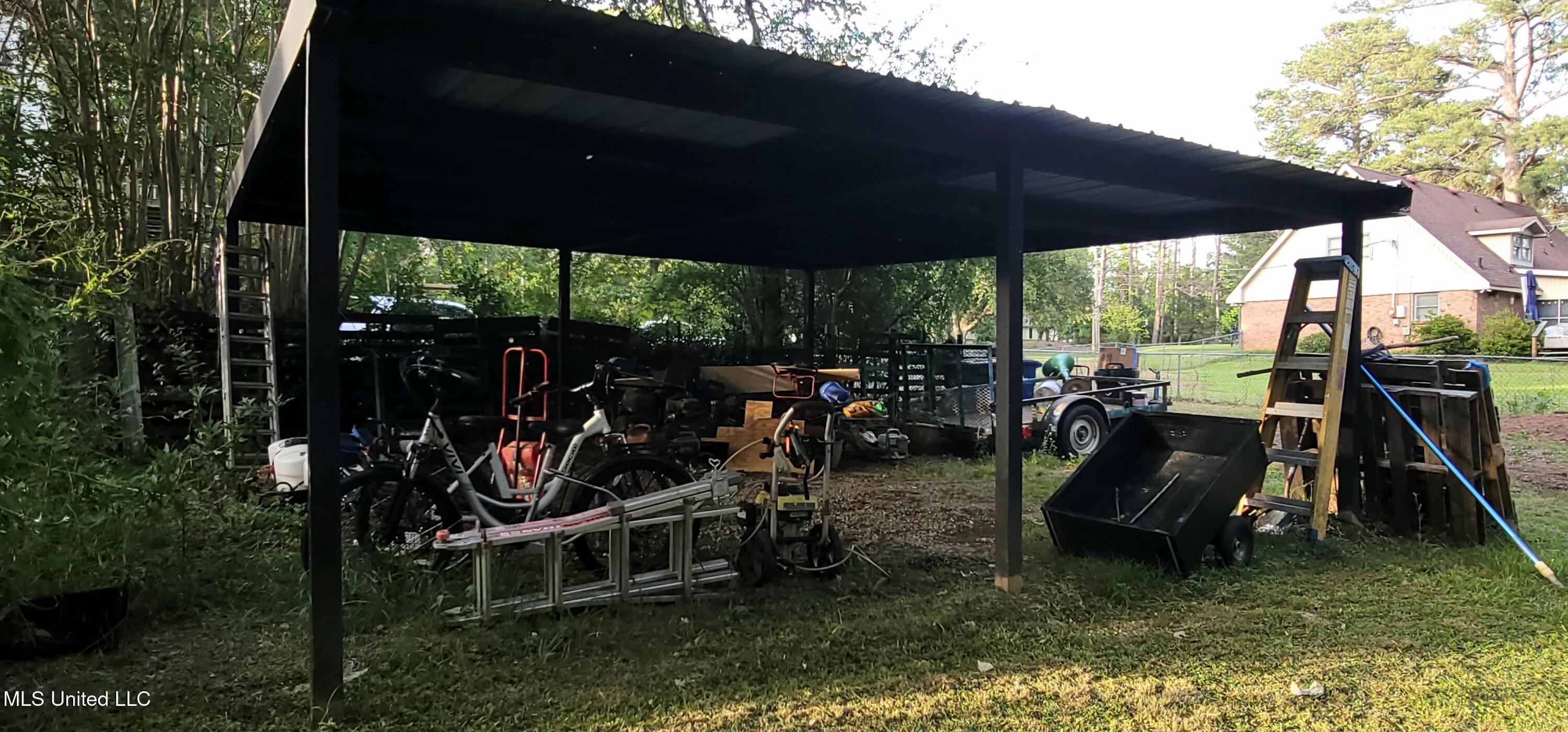 415 St Augustine Drive Madison, MS 39110 - Photo 46 of 52 Pole barn/covered area for mowers