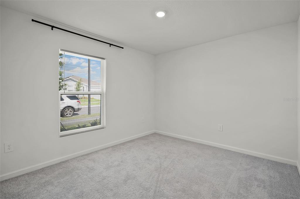 2110 Lasso Loop Eagle Lake, FL 33839 - Photo 12 of 33 an empty room with windows and closet