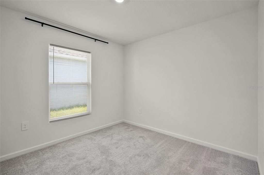 2110 Lasso Loop Eagle Lake, FL 33839 - Photo 14 of 33 an empty room with a window