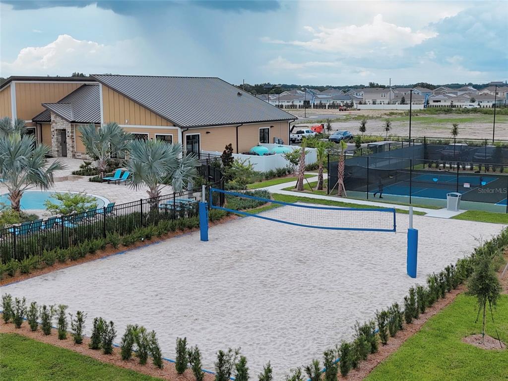 2110 Lasso Loop Eagle Lake, FL 33839 - Photo 21 of 33 a view of a house with a yard and potted plants