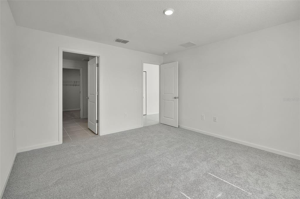 2110 Lasso Loop Eagle Lake, FL 33839 - Photo 7 of 33 a view of an empty room and closet area