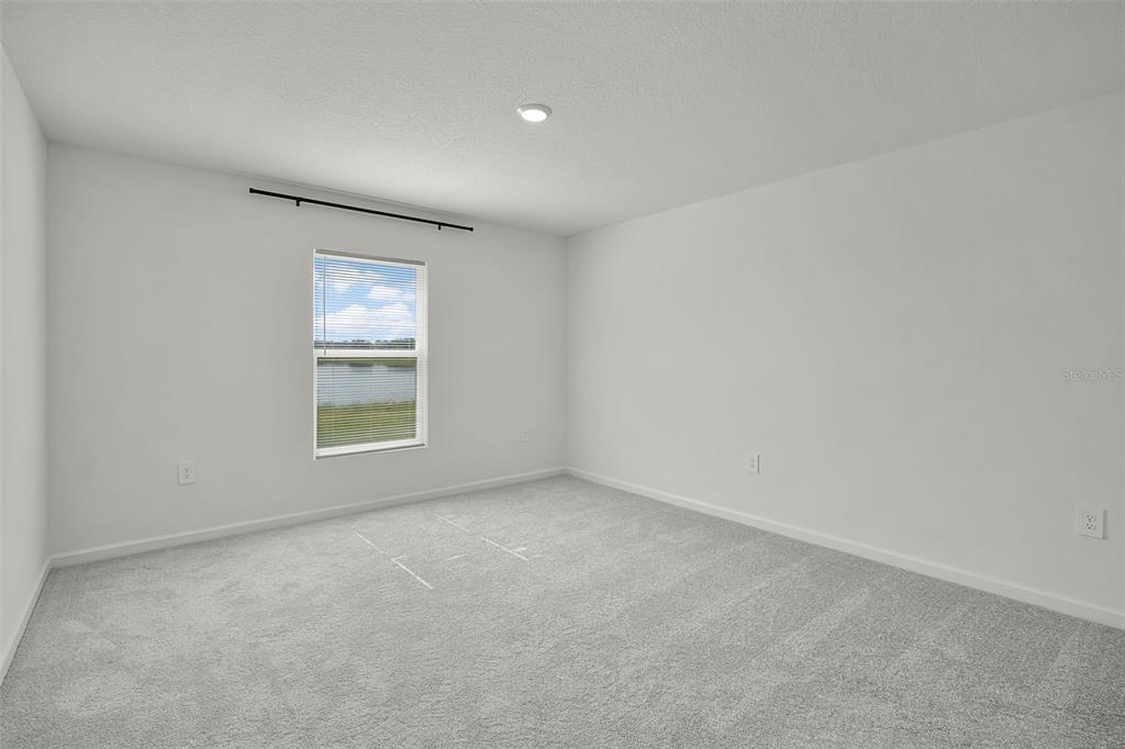 2110 Lasso Loop Eagle Lake, FL 33839 - Photo 8 of 33 an empty room with windows