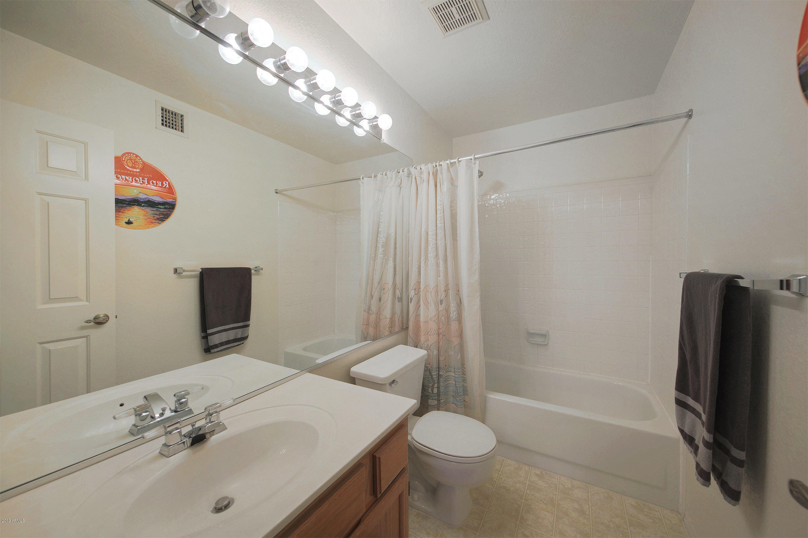 4217 East Agave Road Phoenix, AZ 85044 - Photo 17 of 20 a bathroom with a sink toilet and shower