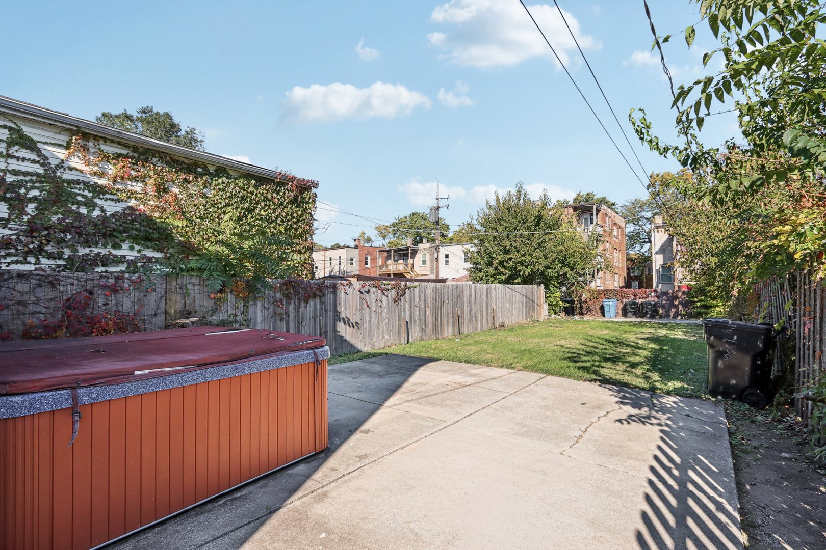 1336 East 73rd Street Chicago, IL 60619 - Photo 27 of 32 a view of a backyard with wooden fence