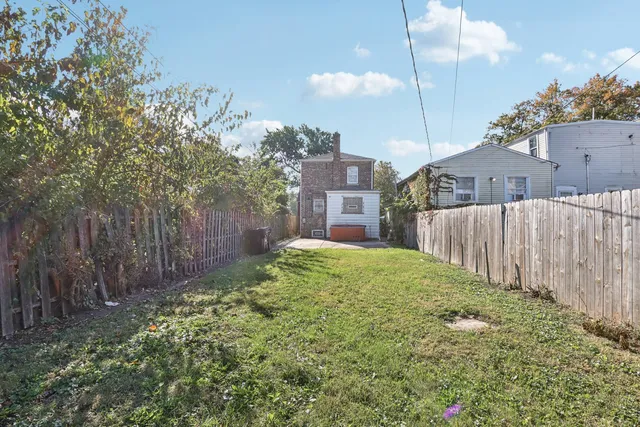 a view of a backyard of the house