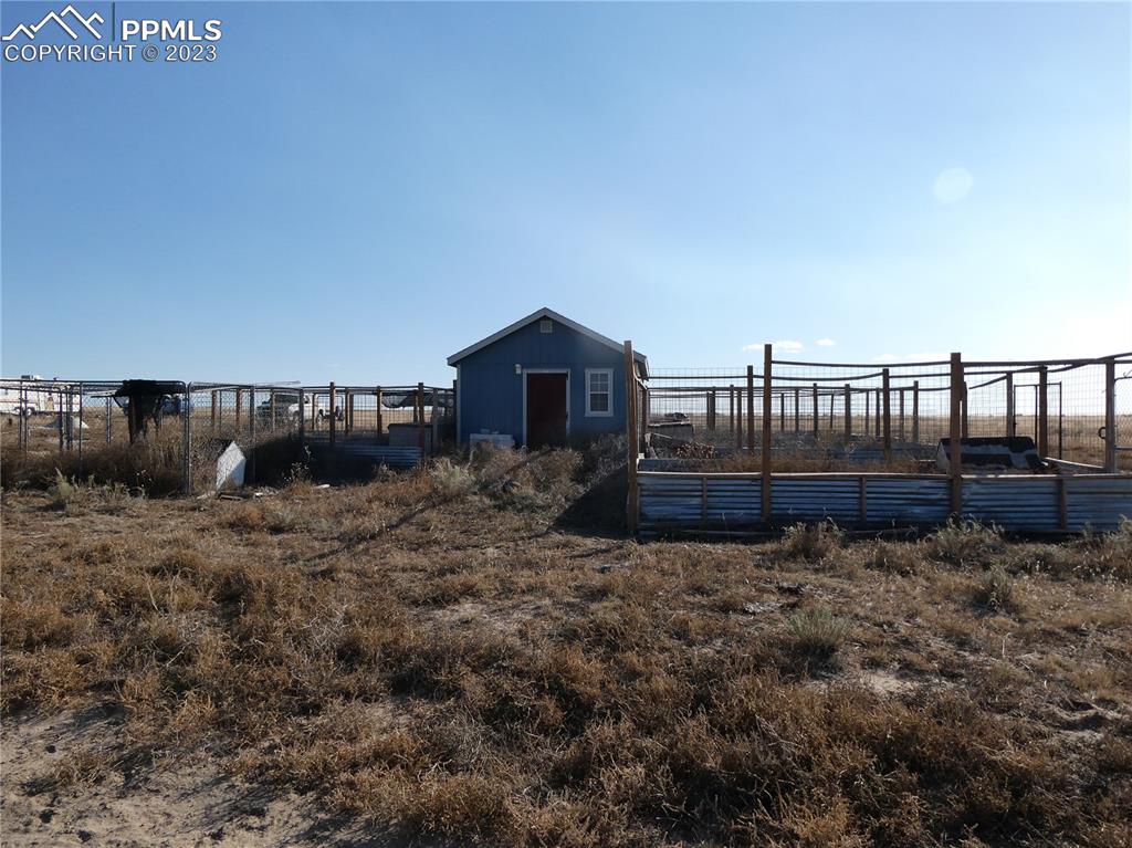 10495 Dan View Yoder, CO 80864 - Photo 15 of 33 a view of a house with a yard and wooden fence