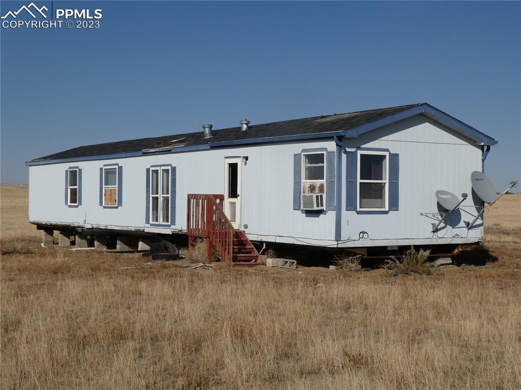 10495 Dan View Yoder, CO 80864 - Photo 4 of 33 a front view of a house with a yard