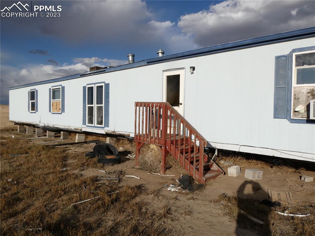 10495 Dan View Yoder, CO 80864 - Photo 6 of 33 a view of a house with a yard