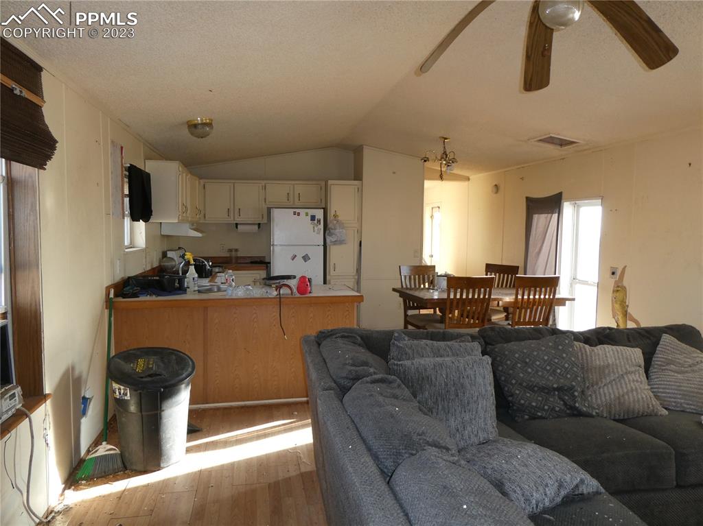 10495 Dan View Yoder, CO 80864 - Photo 8 of 33 a living room with furniture and kitchen view