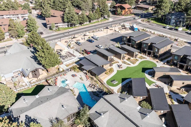 an aerial view of a house with a swimming pool