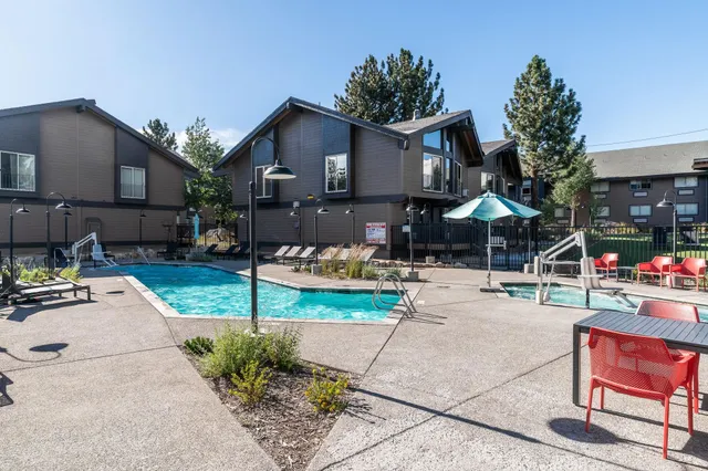 a view of a swimming pool with a patio
