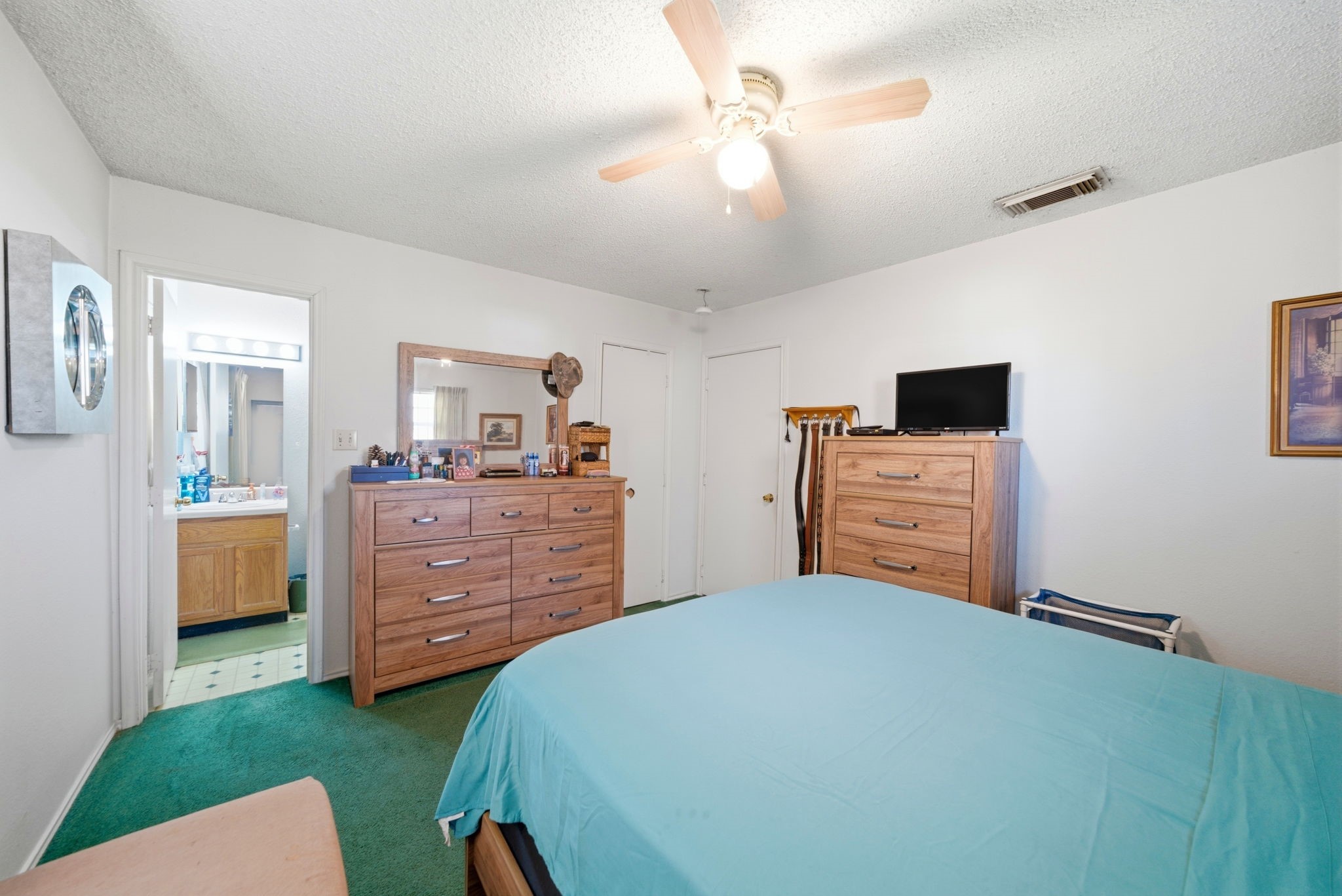 5109 Fitch Street Houston, TX 77016 - Photo 11 of 22 a bed room with a bed and a television