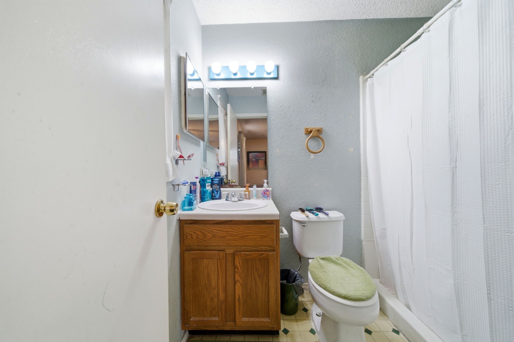 5109 Fitch Street Houston, TX 77016 - Photo 15 of 22 a bathroom with a toilet a sink and mirror