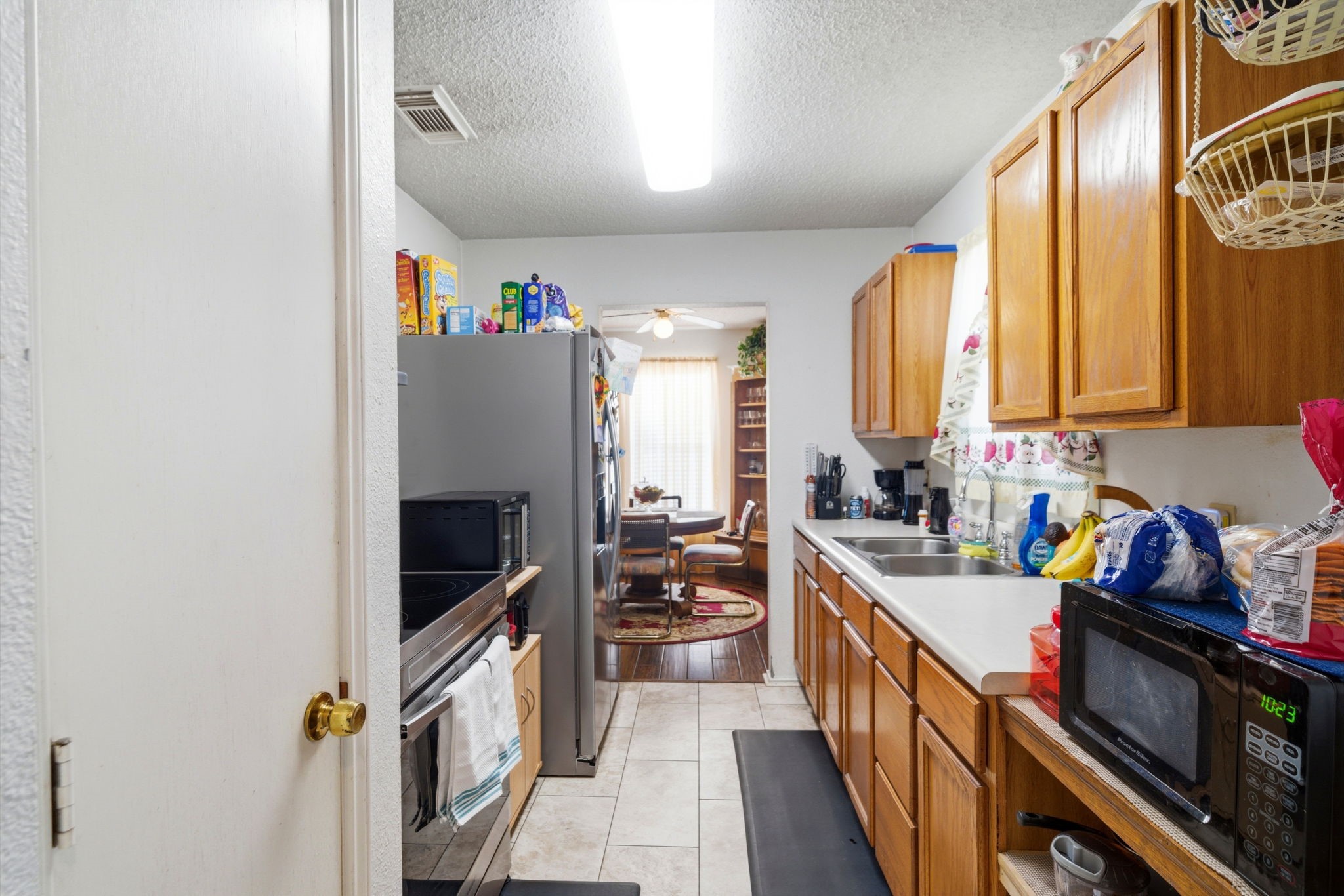 5109 Fitch Street Houston, TX 77016 - Photo 2 of 22 a kitchen with stainless steel appliances a refrigerator sink and cabinets