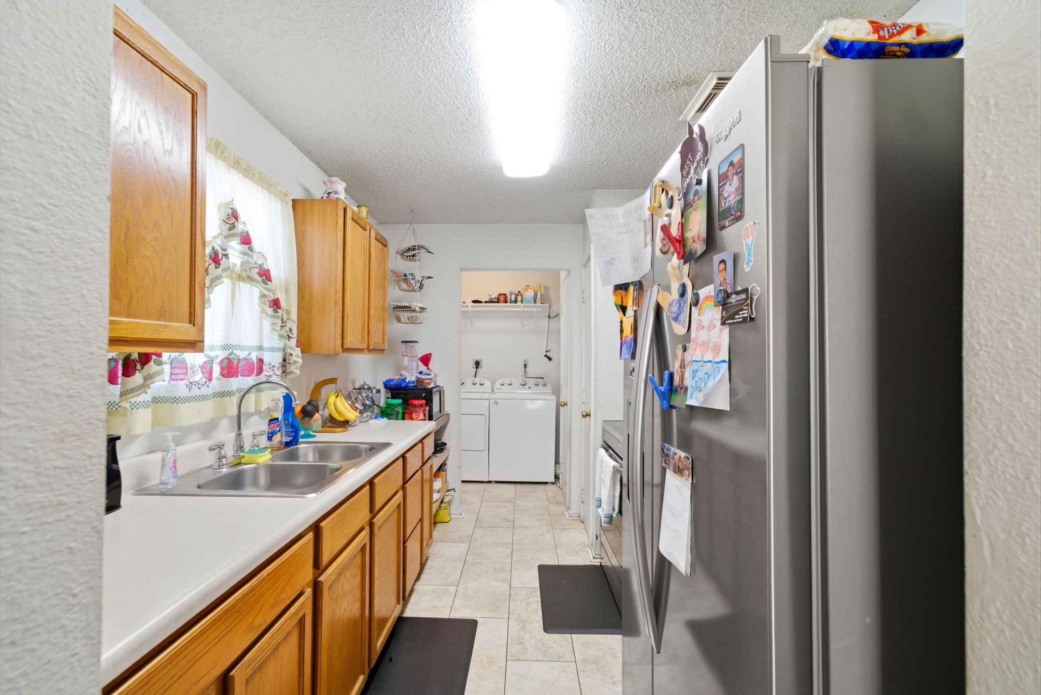 5109 Fitch Street Houston, TX 77016 - Photo 10 of 22 a kitchen with stainless steel appliances granite countertop a refrigerator and a sink