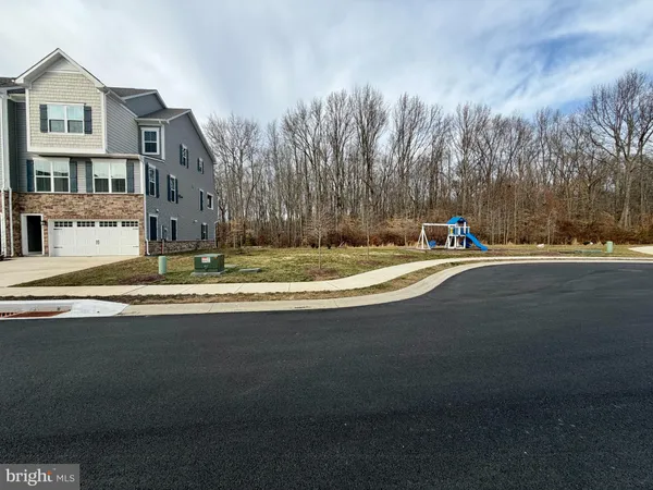 a swimming pool with buildings in background