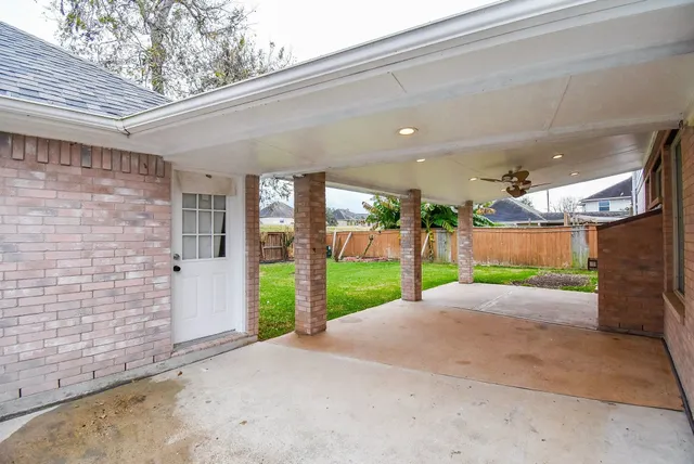 a view of a house with a yard and garage