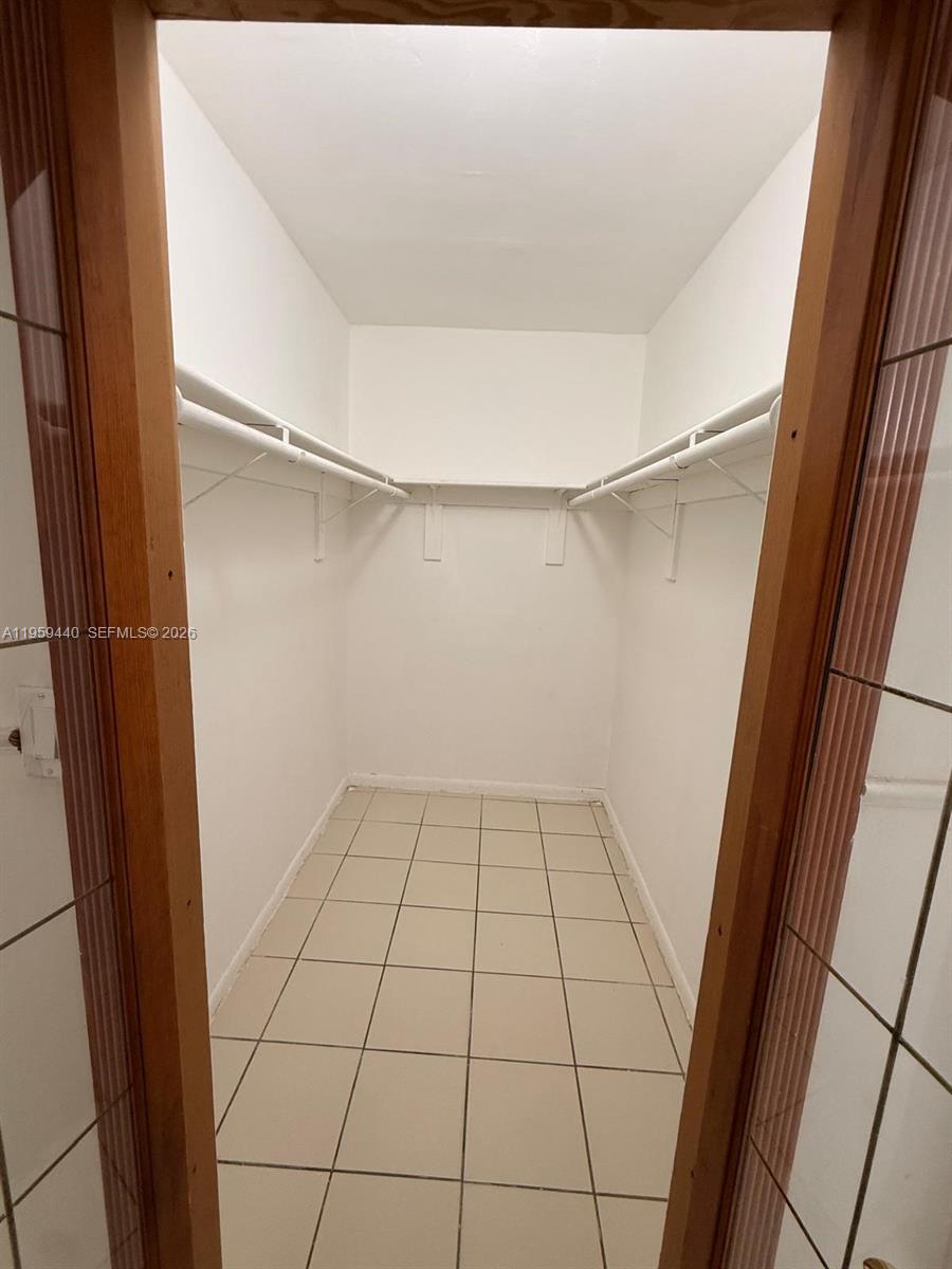 6205 Southwest 131st Court, Unit 104 Miami, FL 33183 - Photo 15 of 21 a view of an empty walk in closet