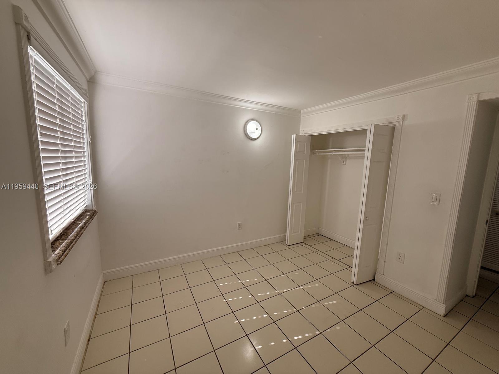 6205 Southwest 131st Court, Unit 104 Miami, FL 33183 - Photo 21 of 21 an empty room with windows
