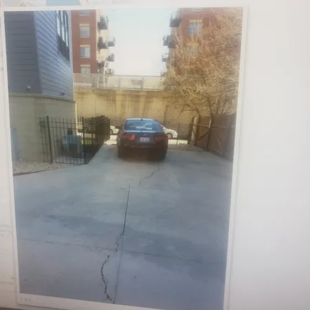 a view of a building with wooden fence
