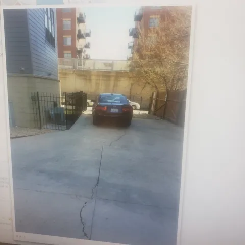 a view of a building with wooden fence