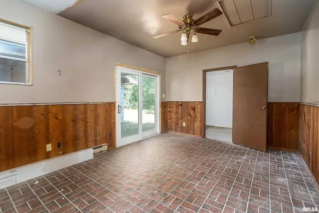 a view of an empty room with a window