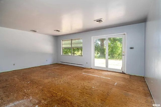 a view of an empty room with a window
