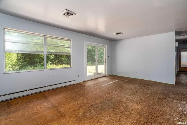 an empty room with windows