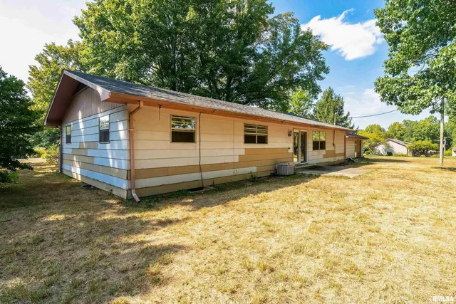 a front view of a house with yard