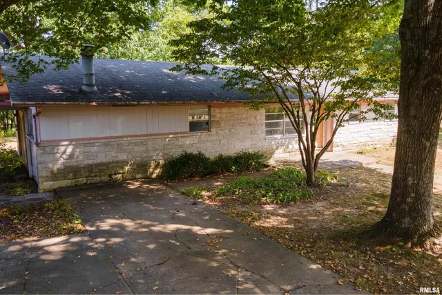 a backyard of a house with lots of green space