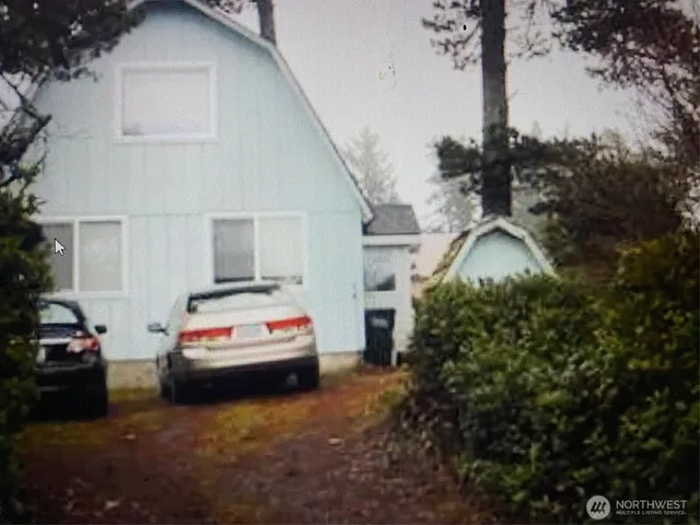 a car parked in front of a house
