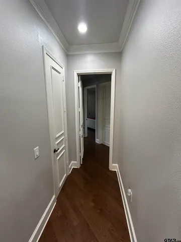 an entryway of a house with wooden floor